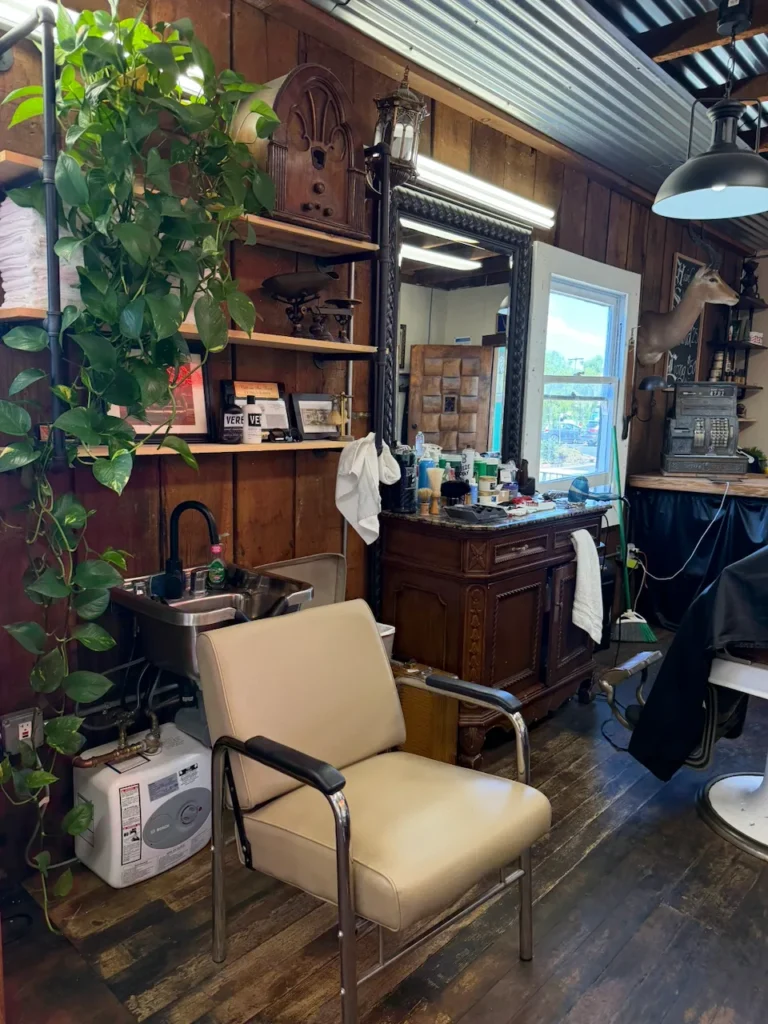 Barber chair and workstation with a vintage cabinet and mirror in Old Town San Diego