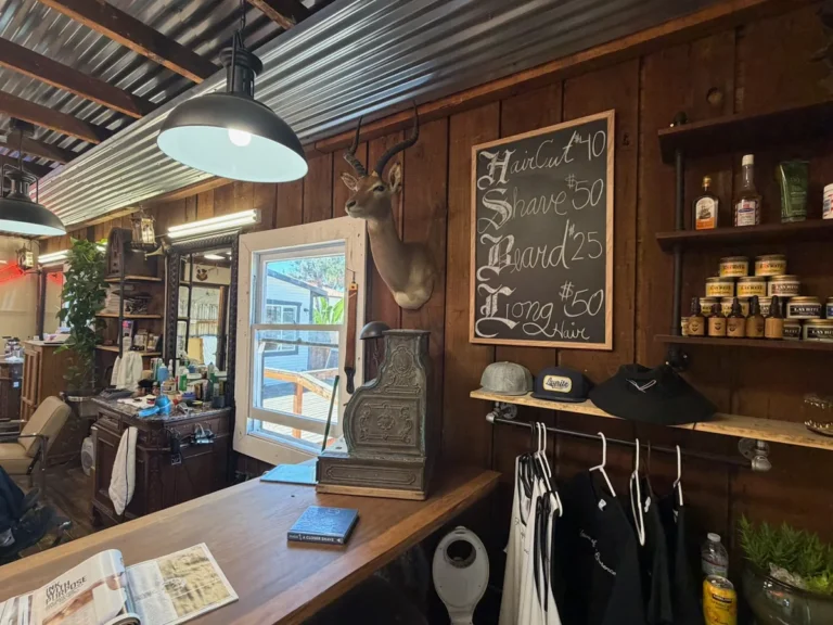 The main room, wood panelling, hanging lamp and the hand-lettered price board in Old Town San Diego
