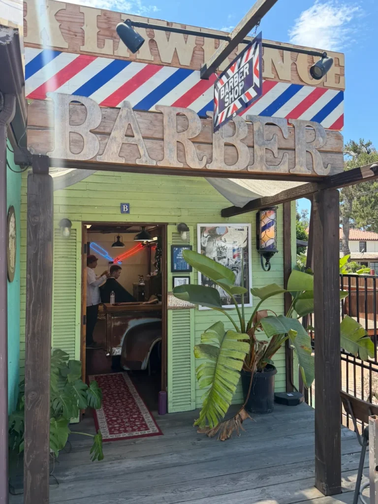 The green storefront on Congress Street with Kory working inside in Old Town San Diego